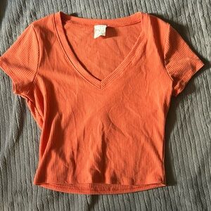 I’m selling a cute orange shirt from FULLTILT that’s medium